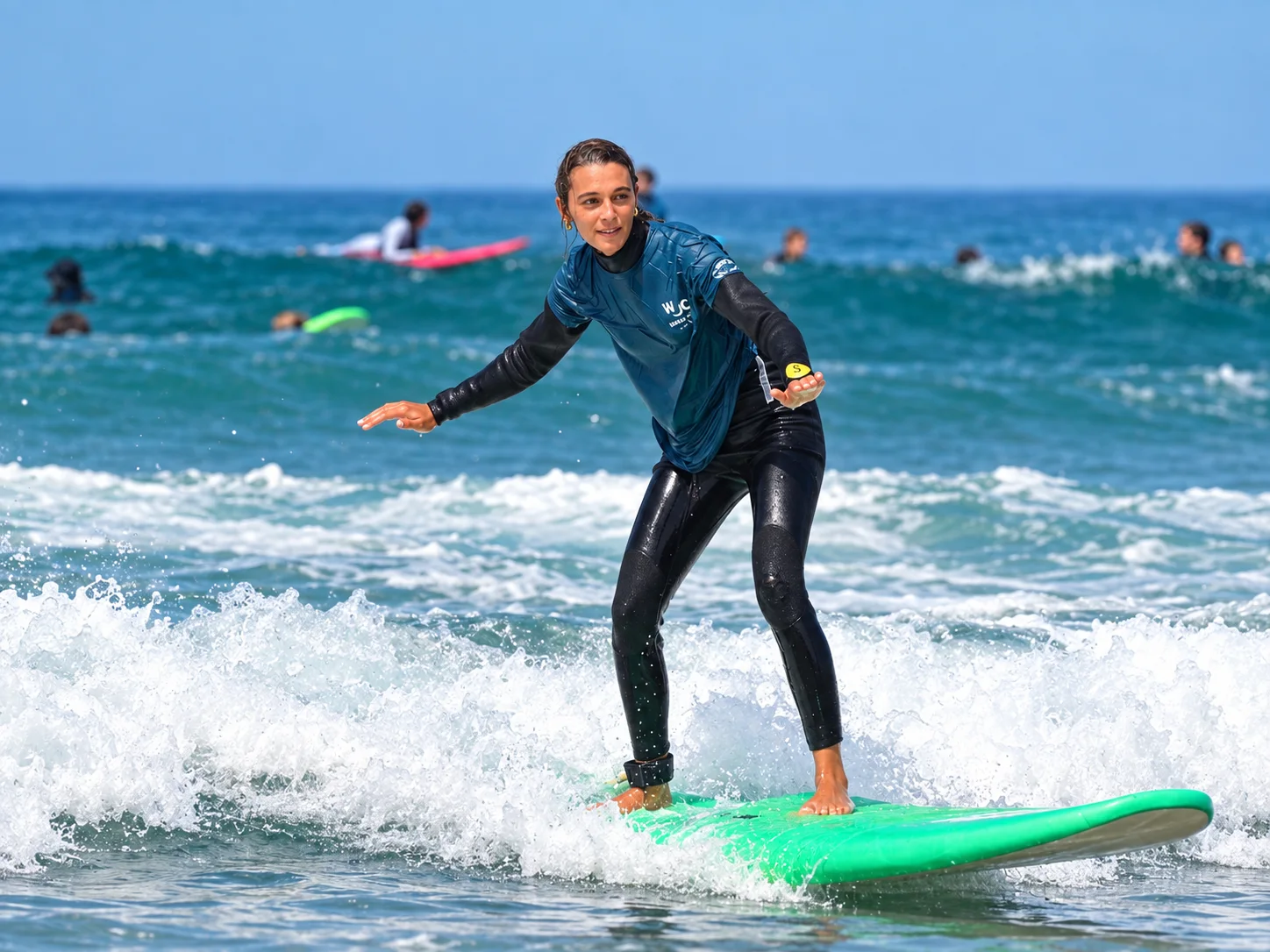 Wake Wave instructor demonstrating board technique during a surf lesson.
